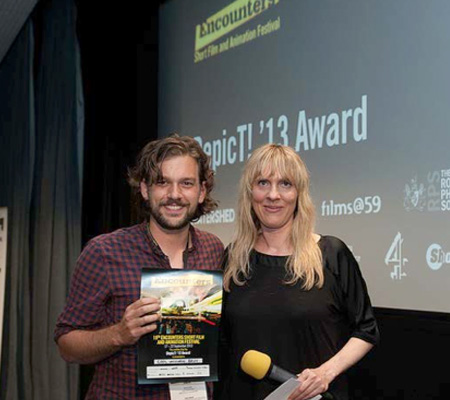 DepicT! 2013 winner Ninian Doff receives one of his awards