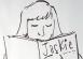 A teenage girl reading 'Jackie' magazine