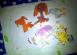 Paper dogs fighting with a paper dragon