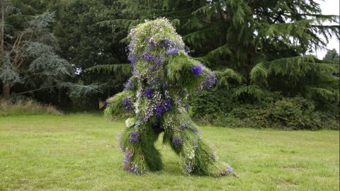 Ashley Peevor's Living Costume - a suit grown from local plants covering the person pictured from head to toe.