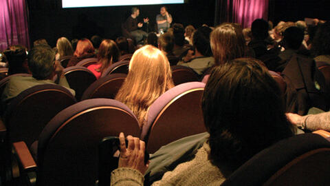 A full cinema at a talk and screening.