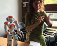 Laura Kriefman with a NAO robot