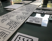 A selection of flash cards with text on them on a black table.