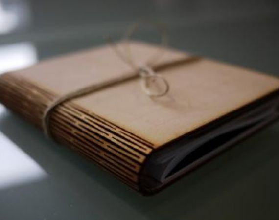 Wooden hand-crafted book for These Pages Fall Like Ash