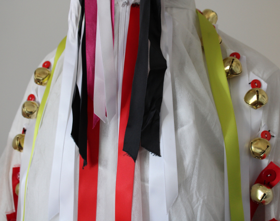 Headshot of a modern Morris dance outfit with ribbons & bells