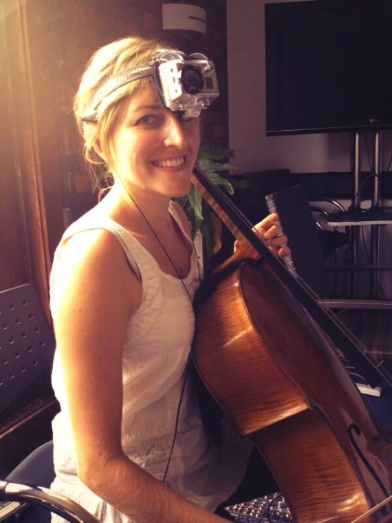 Cello player wearing a go-pro camera on her head