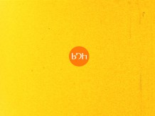 a yellow background with an orange circle in the centre. In this are the letters BDH