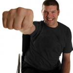 Screen Shot 2012-06-23 at 06.45.53 A photo of laurence Clark, is hand and arm raised making a fist towards the camera so his hand appears very big.
