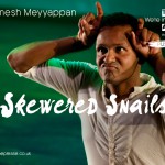 Ramesh-Meyyappan-PUSH-ME-Artist-Image Ramesh Meyyappann in a head and upper body shot. His fingers are making his head look like a snail. text reads ramesh meyyappan, skewered snails, push me.