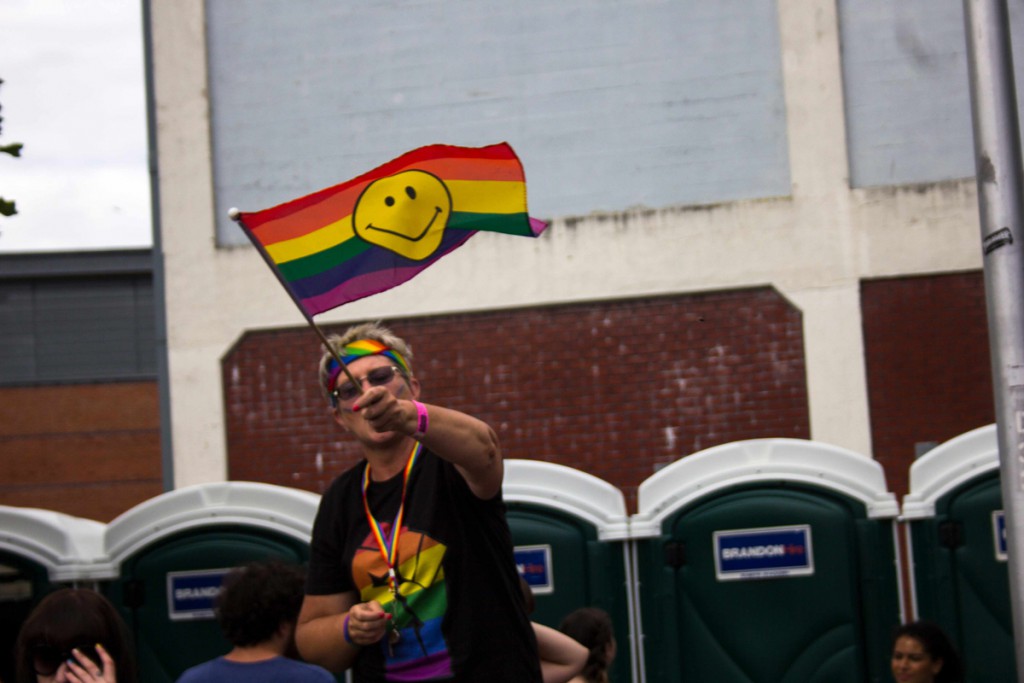 Proudly waving their smiley-face/pride flag.