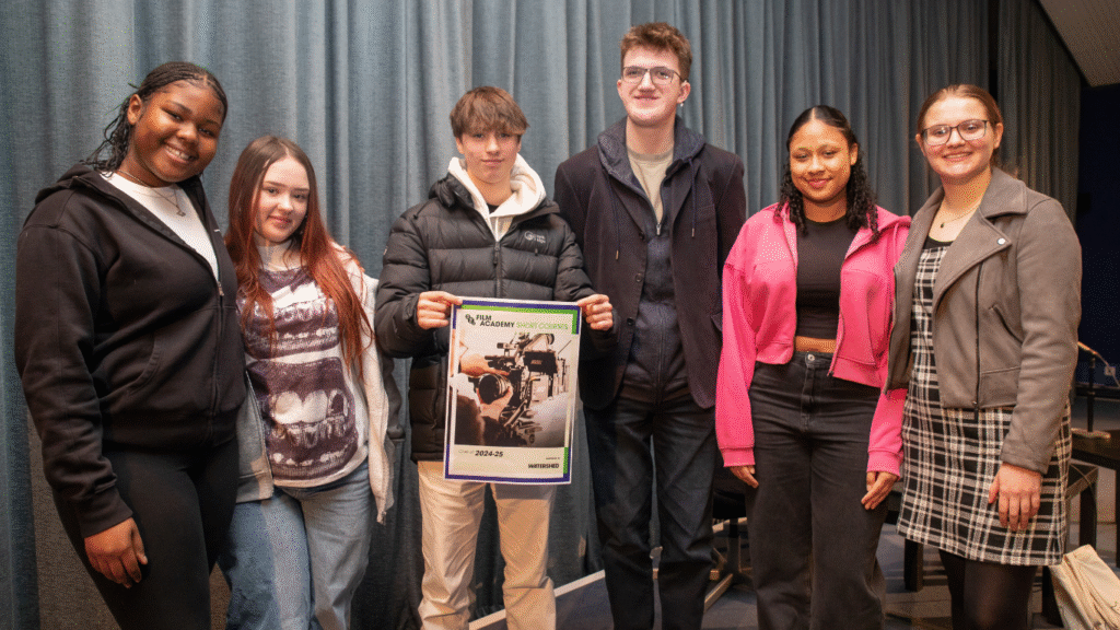 Six young creatives holding a poster of BFI Film Academy Short Course