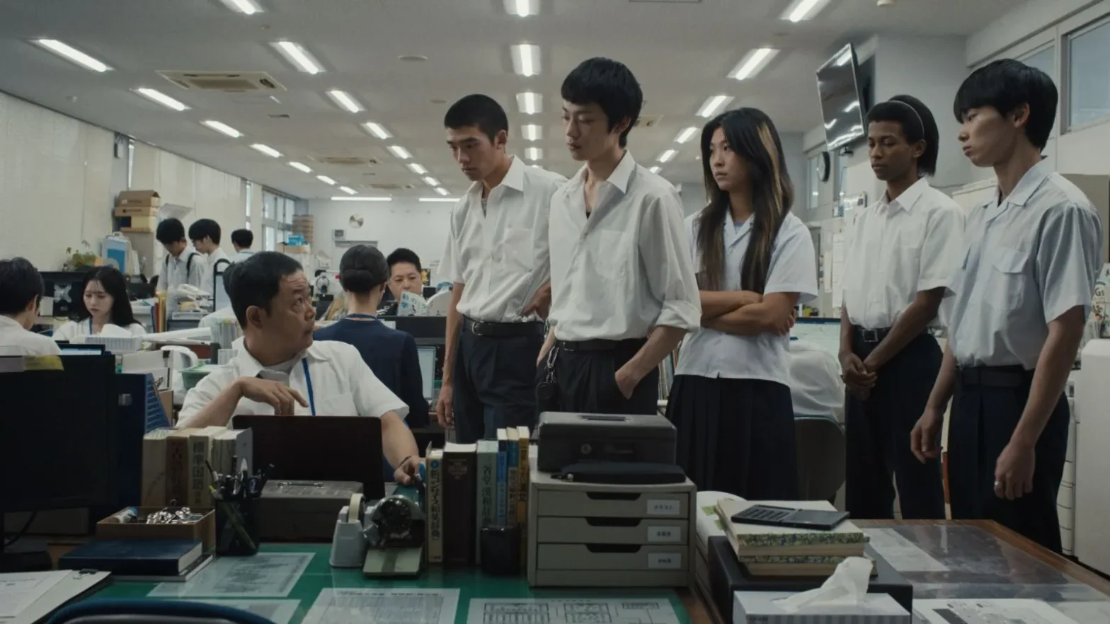 A group of people stood an office