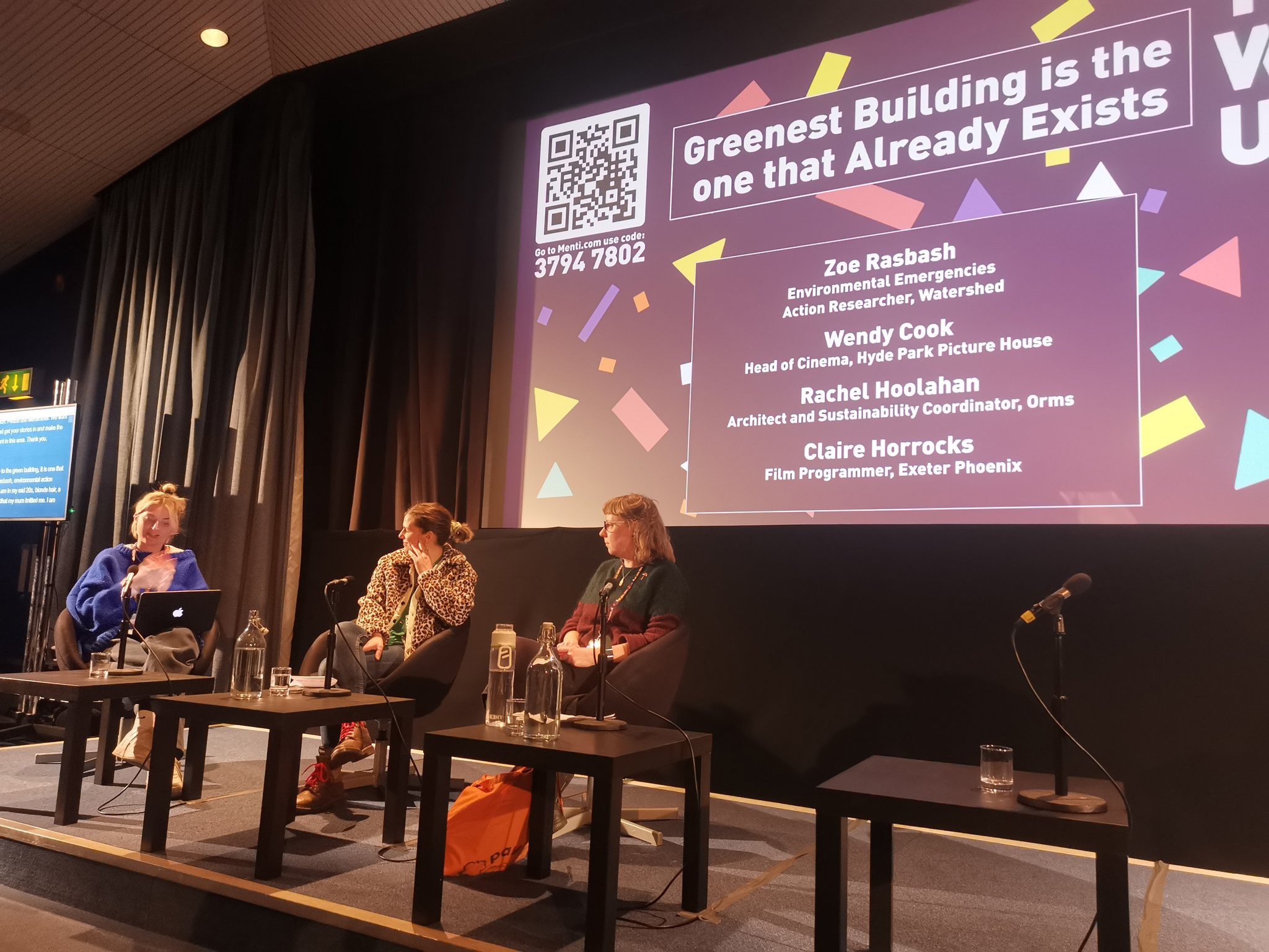 panel discussion in cinema setting