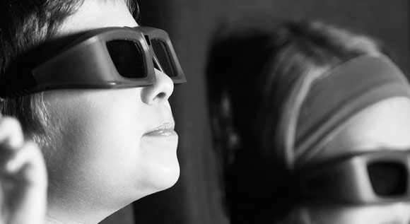 Kids watching a 3D film at the cinema