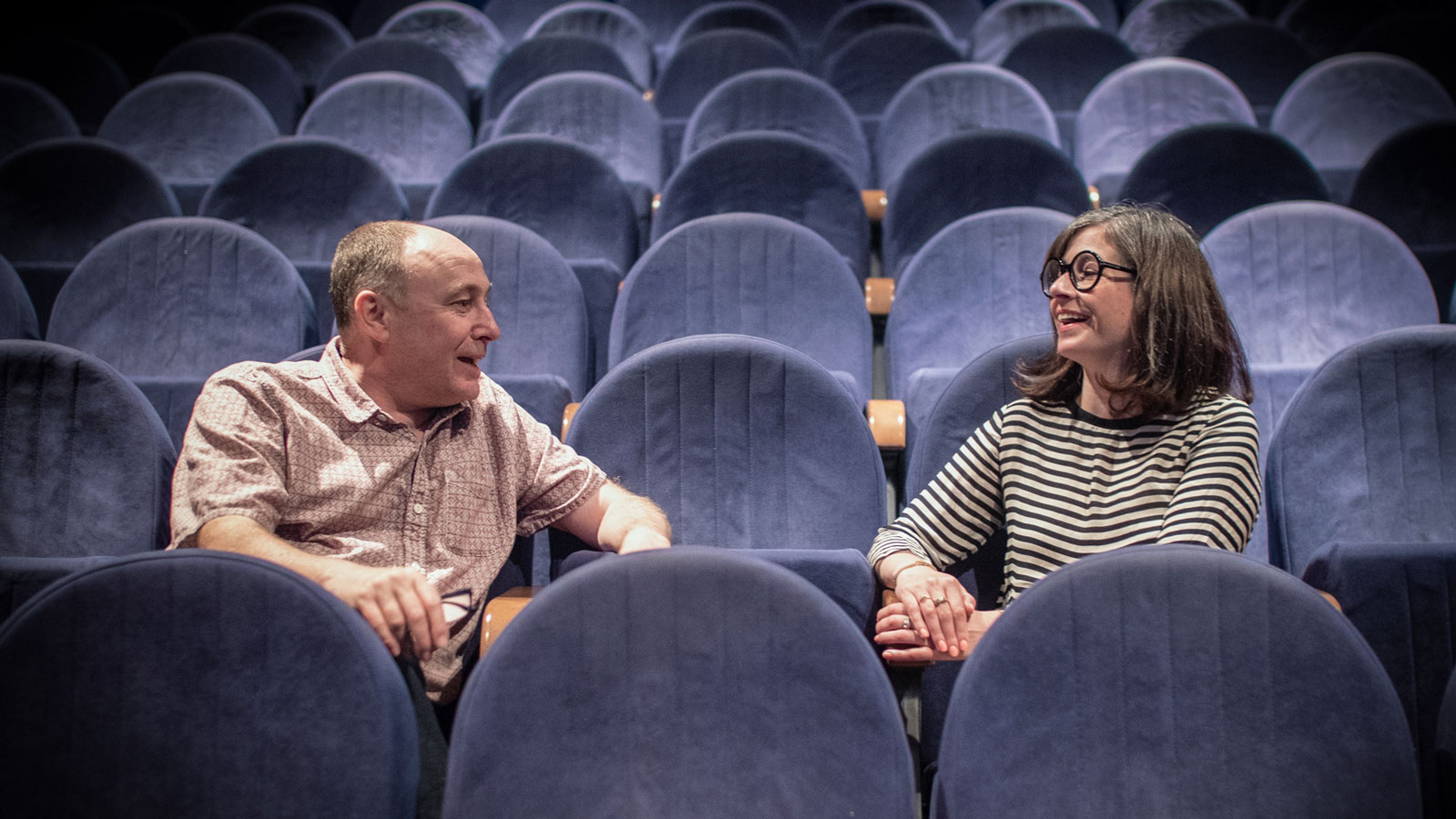 Photo of Mark Cosgrove and Tara Judah sitting in a cinema at Watershed