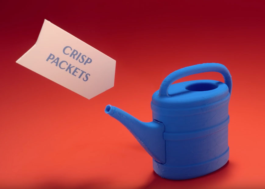 Photo of a watering can made out of crips packets