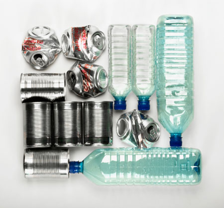 Photo of plastic bottles and links cans cleaned and ready for recycling