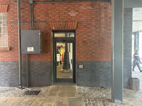 Photo of ramped electronically assisted entrance door to Watershed.