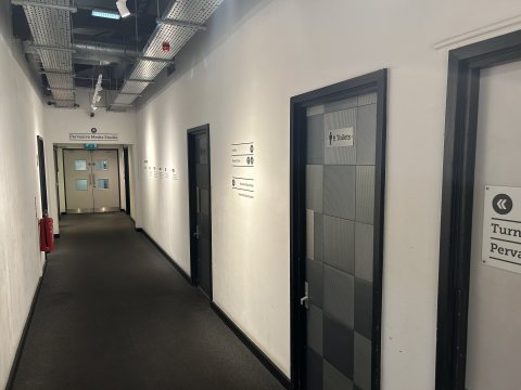 Photo of the corridor towards the Pervasive Media Studio showing the two doors to the toilets.