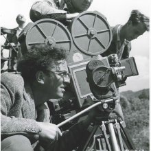 Vintage photo of Douglas Slocombe operating a movie camera 