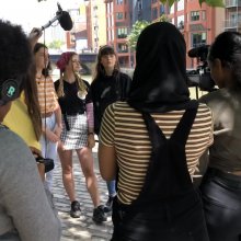 Group of young people filming.