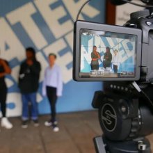 Young people filming outside Watershed building