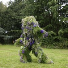 Ashley Peevor's Living Costume - a suit grown from local plants covering the person pictured from head to toe.