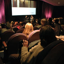 A full cinema at a talk and screening.