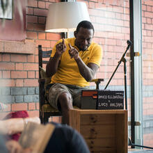 David Ellington, a Deaf Bristol artist and filmmaker, reading Matilda at last Friday's Read-in-a-day (Credit: Jon Aitken)