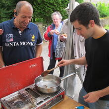 David Lisser cooking insects in his Future food café at Allenheads Village show, 2011