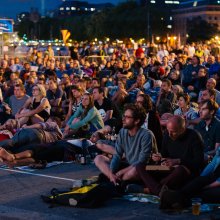 Seated audience at outdoor screening