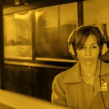 Photo of a woman wearing headphones