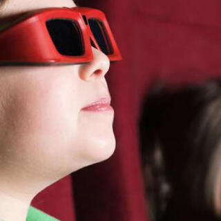 Photo of a boy wearing 3d glasses