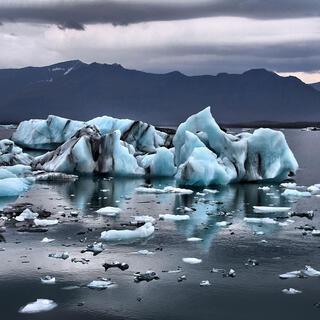 A photo of icebergs floating in the sea