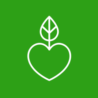 A white heart with a leaf growing out the top on a green background.