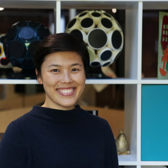 Anne Wong-Erven, General Manager smiling to camera in Watershed Cafe/Bar