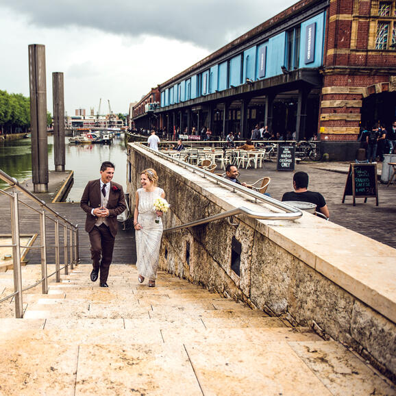 Photo of a bride groom outside of Watershed