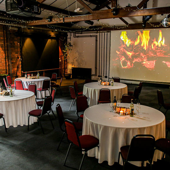 Photo of a conference room with christmas decorations and dining tables set out