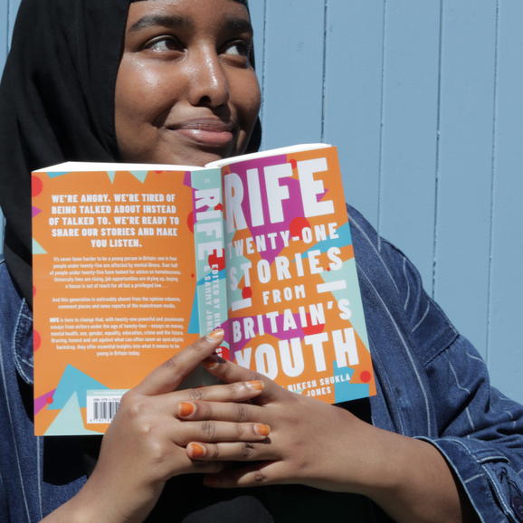 Woman smiling with open book