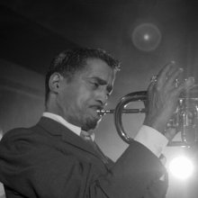 an image of a man playing a trumpet 