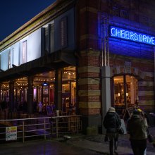 Exterior shot of Watershed building with 'Cheers Drive' sign.