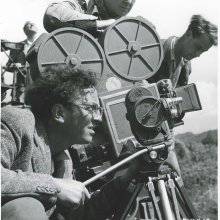Vintage photo of Douglas Slocombe operating a movie camera 