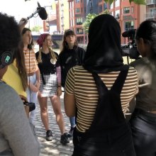 Group of young people filming.