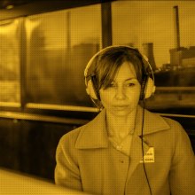 Photo of a woman wearing headphones