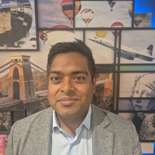 Head shot of a smiling man against a backdrop of pictures including, Concorde, hot air balloons and the Clifton Suspension Bridge