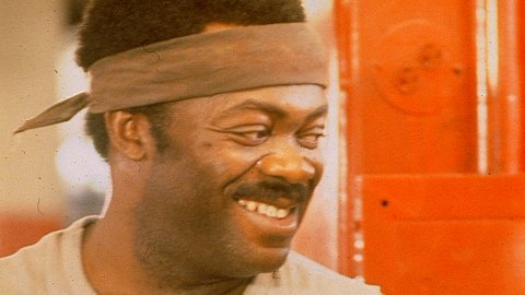 Head shot of actor Yaphet Kotto, 1970s feel to the image with the man smiling