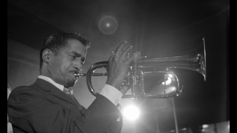 an image of a man playing a trumpet