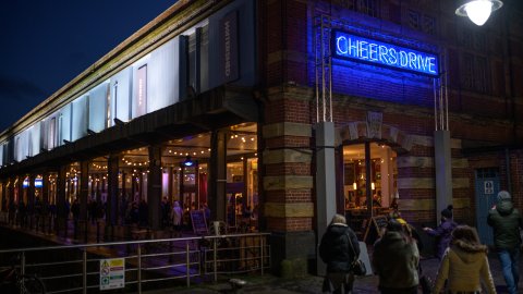 Exterior shot of Watershed building with 'Cheers Drive' sign.