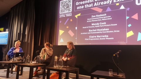 panel discussion in cinema setting