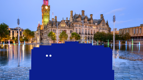 A big blue character is in the middle of Bradford city centre.